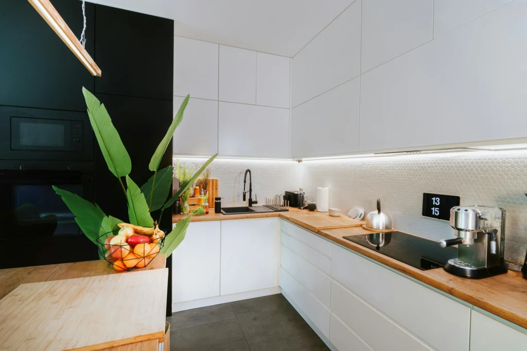 Compact and organized kitchen with hidden smart devices and a clean look.
